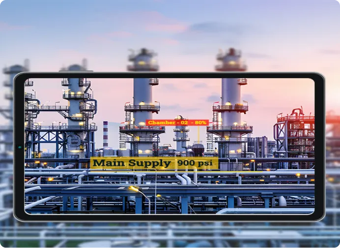 a tv screen with a picture of an oil refinery in the background